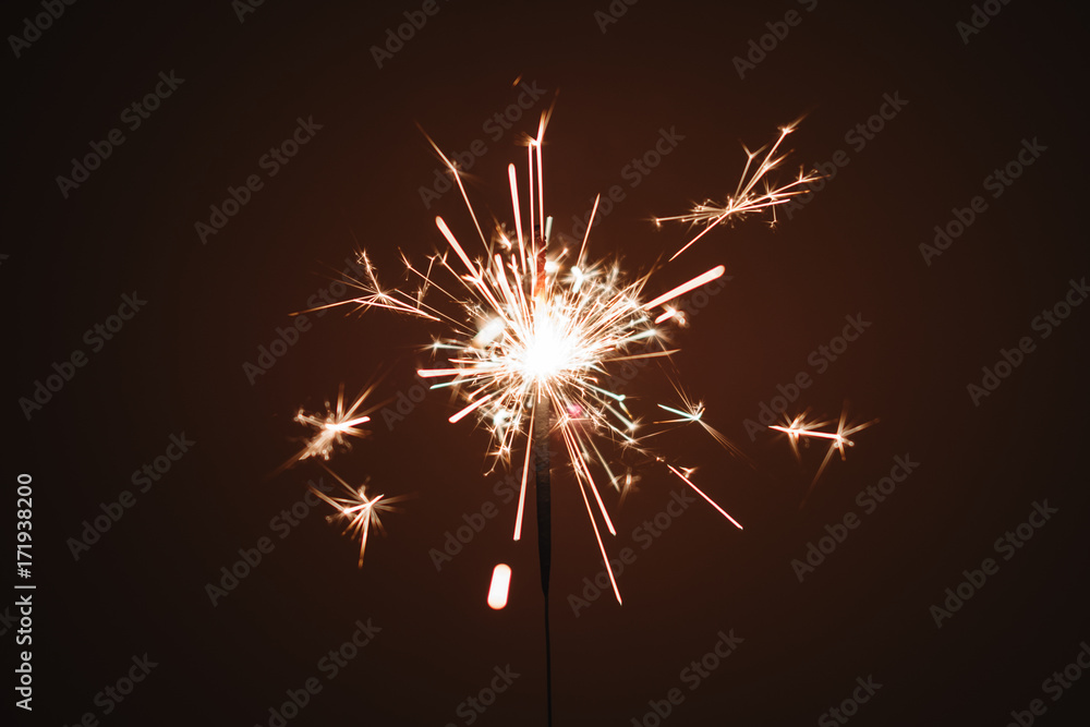 Sparkler firework light glowing in the dark, for celebration and birthday 