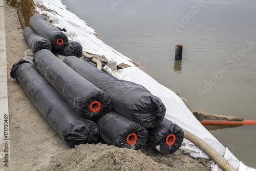 Geotextile tubes for river bank protection photo