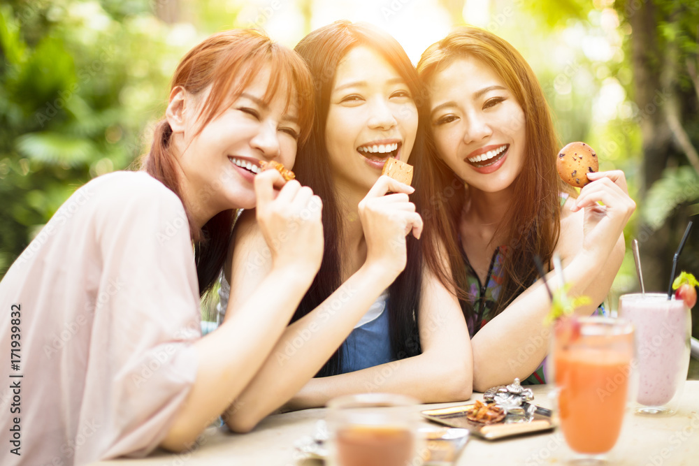 Group of young woman laughing in restaurant Group of young woman laughing in restaurant