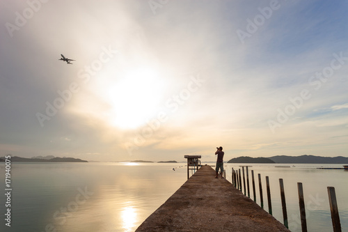 scenery view of old jetty to the sea beautiful sunrise or sunset in phuket thailand.