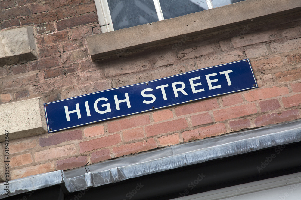 Obraz premium High Street Sign on Brick Wall Facade