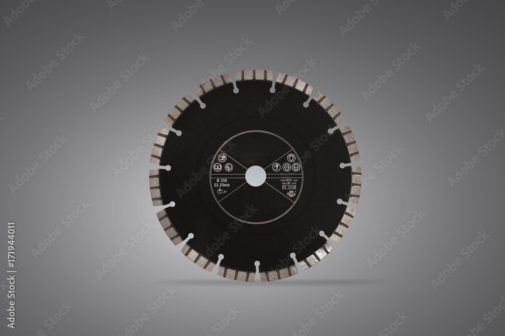 Cutting disc with diamonds - Diamond disc for concrete isolated on the gray background Cutting disc with diamonds - Diamond disc for concrete isolated on the gray background