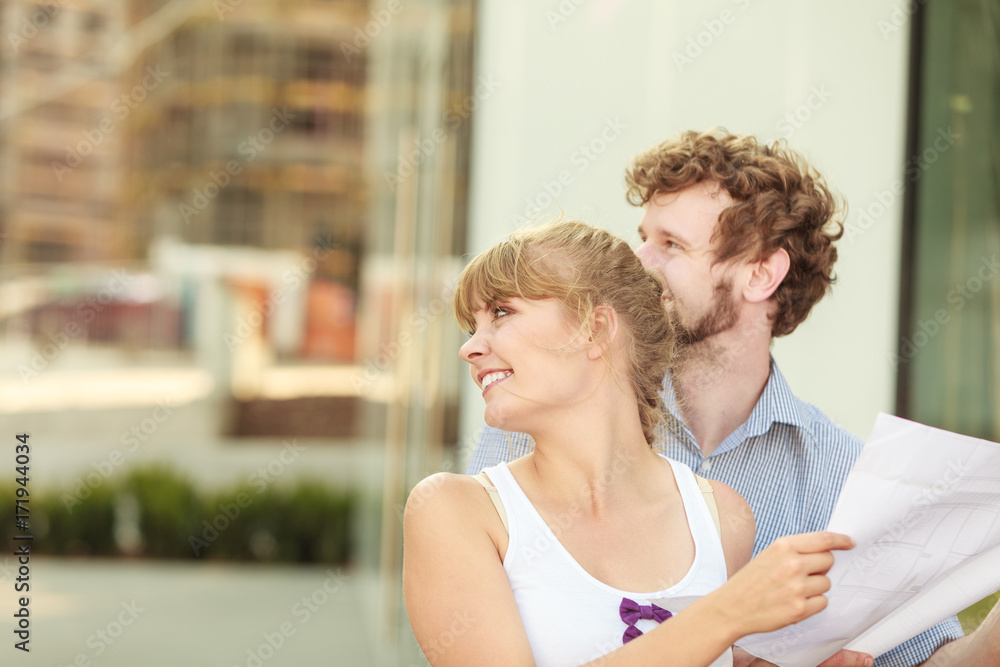 couple with blueprint project outdoor couple with blueprint project outdoor