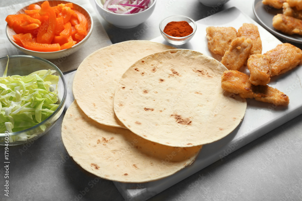 Ingredients for fish tacos on table Ingredients for fish tacos on table