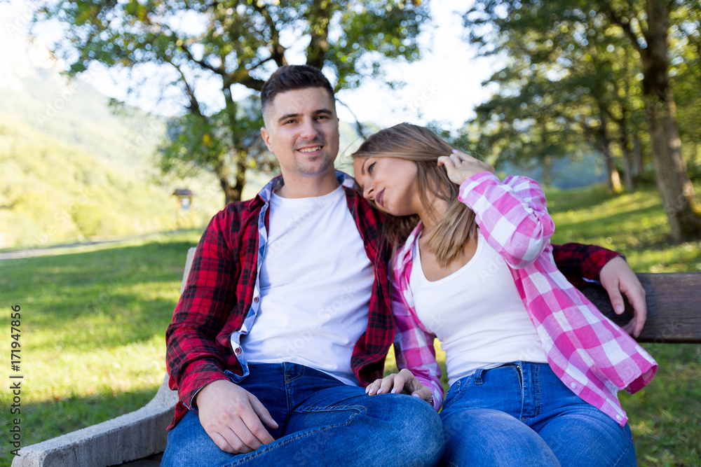summer holidays, love, romance and people concept - happy smiling young couple outdoors summer holidays, love, romance and people concept - happy smiling young couple outdoors