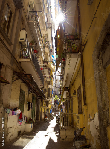 Narrow street in old town of Naples city in Italy