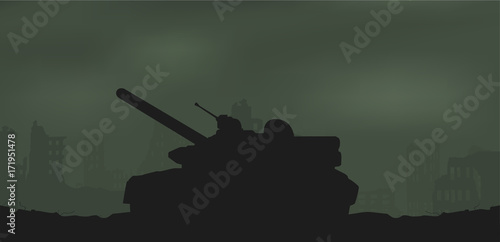 Battle tank and destroyed houses.