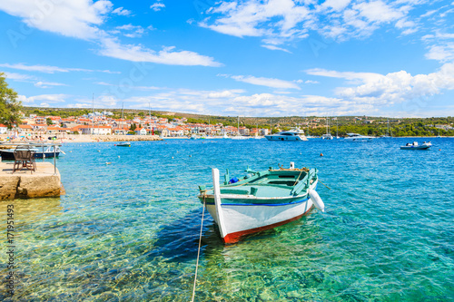 Colorful fishing boat on turquoise sea water in Primosten port, Dalmatia, Croatia