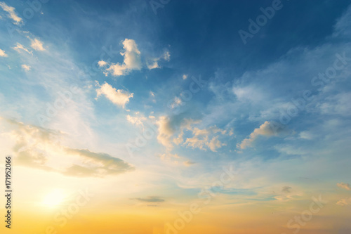 Fototapeta Naklejka Na Ścianę i Meble -  Sky background at sunset,Sky blue and orange light of the sun through the clouds in the sky