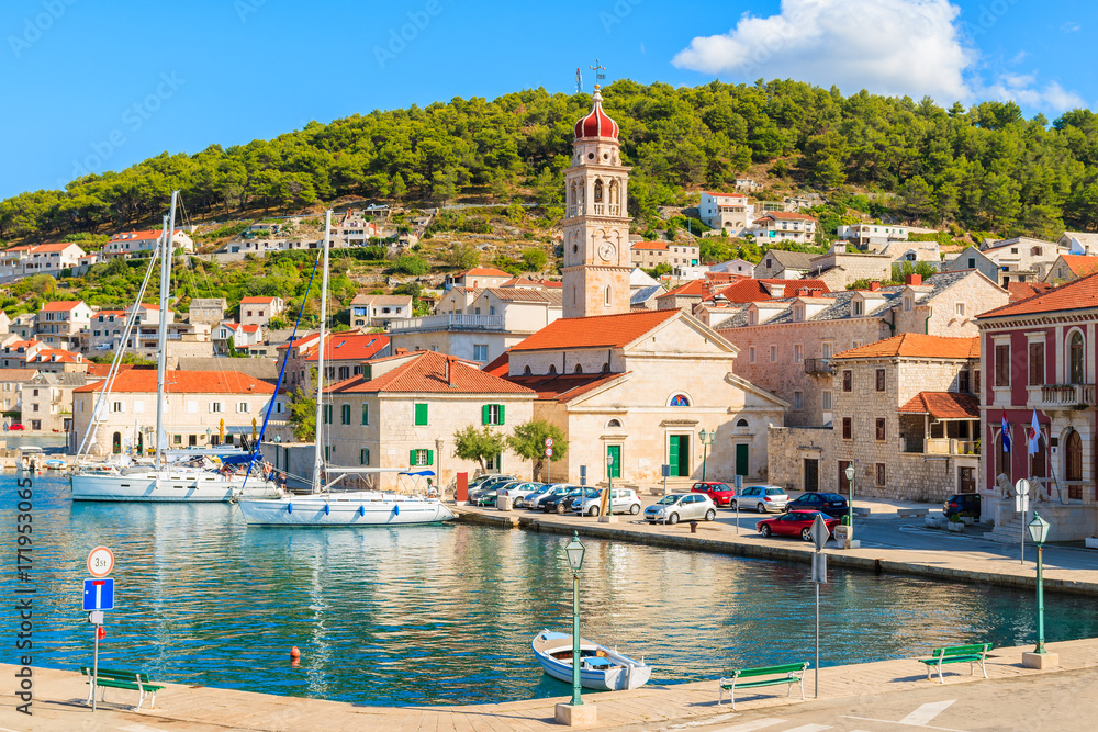 View of picturesque Pucisca port with beautiful church, Brac island, Croatia