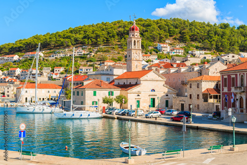 View of picturesque Pucisca port with beautiful church, Brac island, Croatia