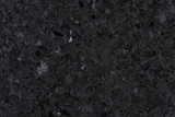 Black granite tile texture and background.