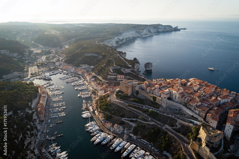 Naklejka premium Aerial view of boats and yachts in marina of historical city Bonifacio, Corsica, France