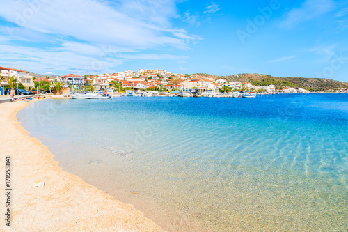 Beach with shallow crystal clear sea water in Rogoznica town, Dalmatia, Croatia