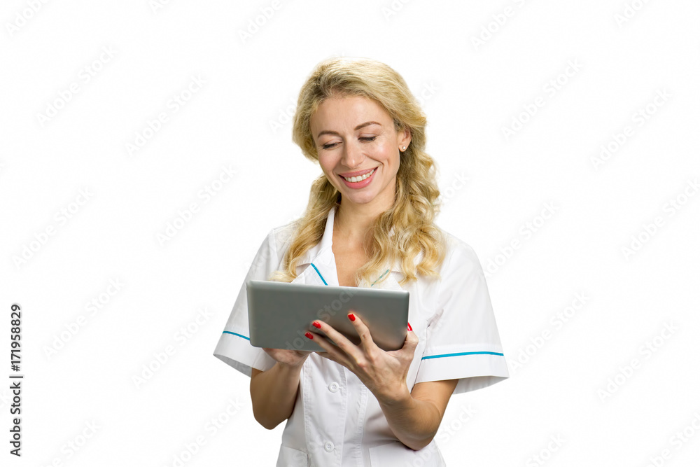 Portrait of cheerful nurse with pc tablet. Smiling young woman doctor using computer tablet with smile on white background. Portrait of cheerful nurse with pc tablet. Smiling young woman doctor using computer tablet with smile on white background.
