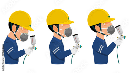 Painter with round mask is using spray gun
