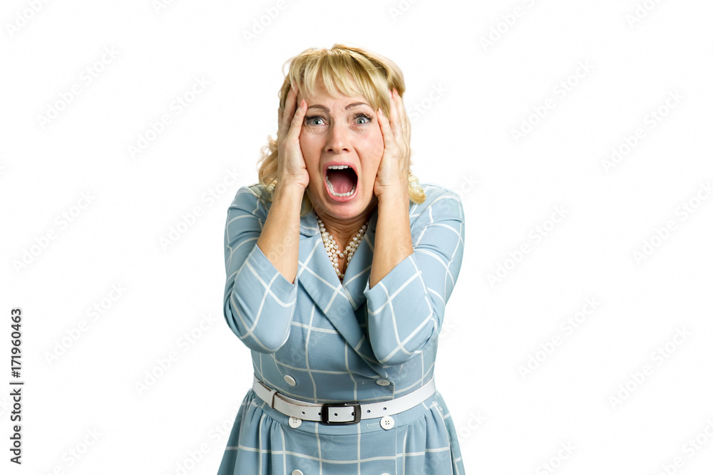 Portrait of screaming desperate woman. Mature woman yelling frustrated screaming out loud and holding her head. Stressed and shocked white-skin blonde businesswoman screaming with desperate. Portrait of screaming desperate woman. Mature woman yelling frustrated screaming out loud and holding her head. Stressed and shocked white-skin blonde businesswoman screaming with desperate.