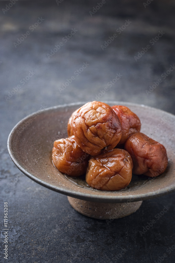 Traditional Japanese umeboshi as close-up in a bowl