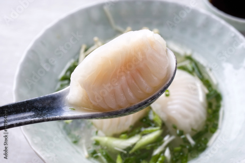 Traditional Japanese gyoza ramen soup as close-up in a bowl