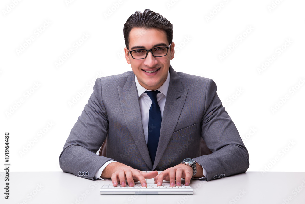 Young businessman typing on a keyboard isolated on white backgro