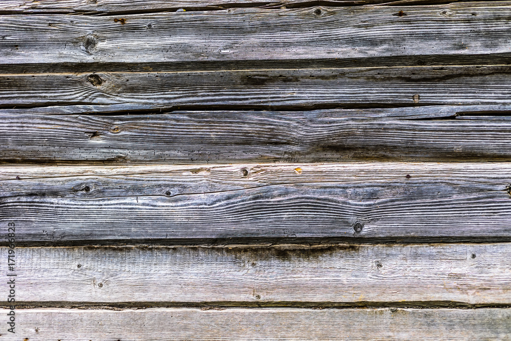 The old wood texture with natural patterns and cracks on the surface as background The old wood texture with natural patterns and cracks on the surface as background