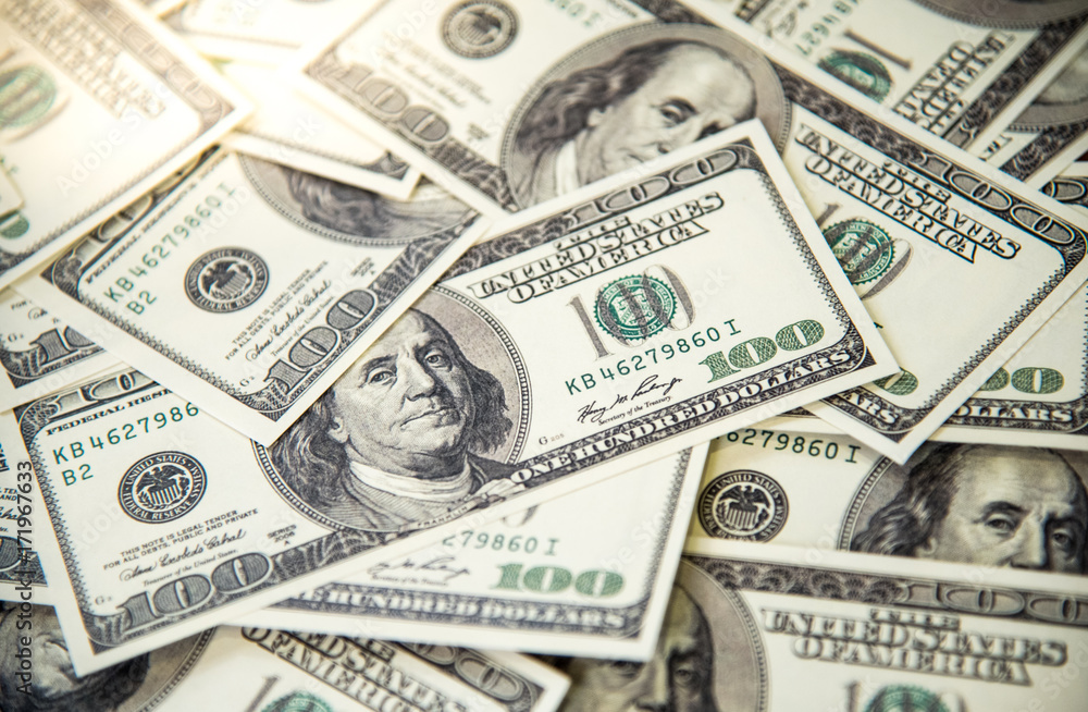 Pile of banknotes of one hundred dollars. Selective focus. Closeup. Background. Pile of banknotes of one hundred dollars. Selective focus. Closeup. Background.