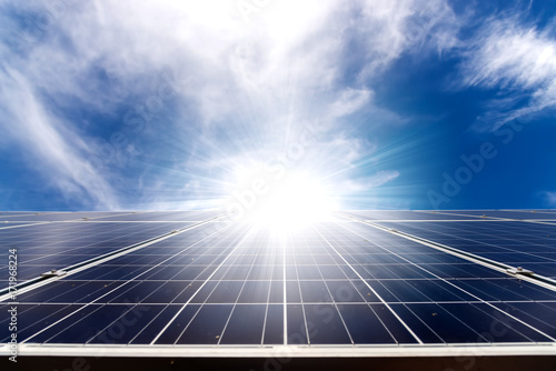 solar cell panel on roof house with strong sun and sky