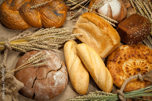 Bread assortment on background of the old canvas photo