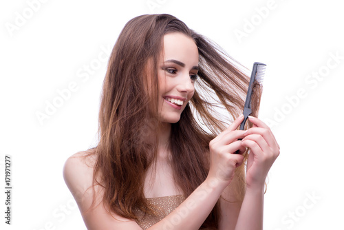 Woman in beauty concept combing hair