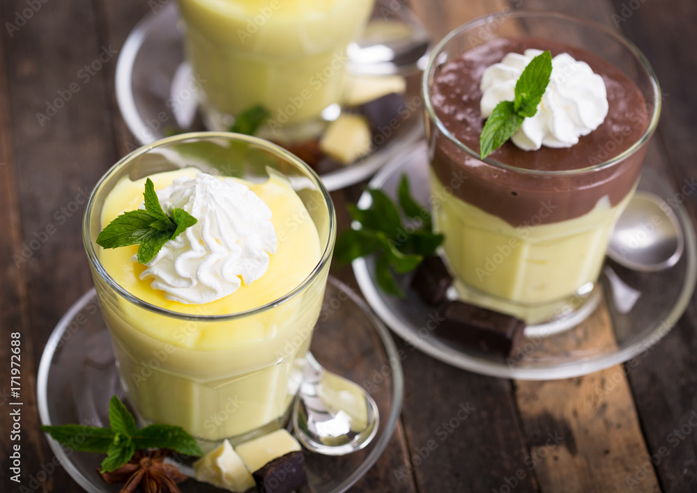 Chocolate and vanilla pudding with whipped cream Chocolate and vanilla pudding with whipped cream
