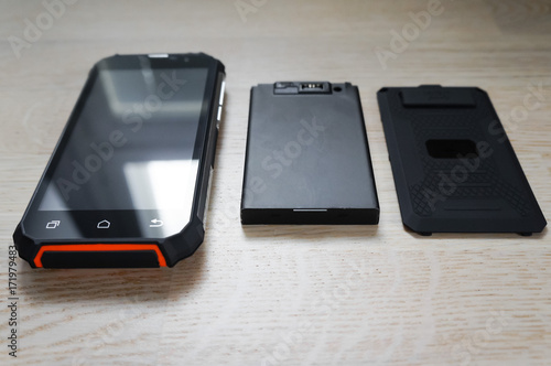New black-orange smartphone with battery and back cover
