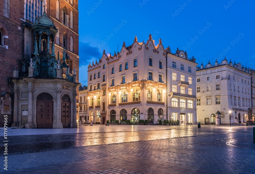 St Mary's church and houses on Main Market Square in Krakow in the night