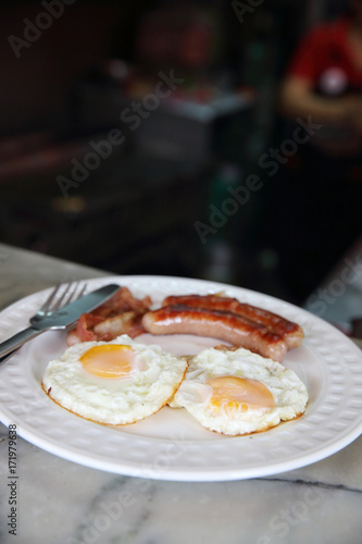 Breakfast Engligh Egg sausage and bacon photo