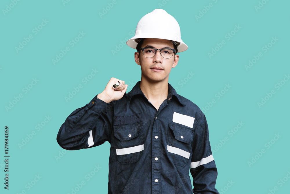 Asian man,Engineer or Technician in white helmet, glasses and blue working shirt suit holding wrench, isolated on green, mechanic and Oil and Gas industrial concept with clipping path Asian man,Engineer or Technician in white helmet, glasses and blue working shirt suit holding wrench, isolated on green, mechanic and Oil and Gas industrial concept with clipping path