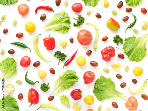 Fototapeta Naklejka Na Ścianę i Meble -  Food collage of fresh vegetables, top view. Corn, pepper, lettuce leaves, tomato isolated on white background. Abstract composition of vegetables. The concept of healthy eating. Food pattern.