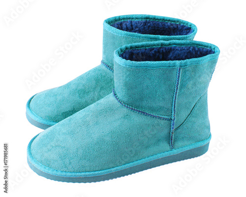 Cyan light blue pair of short winter ugg boots isolated white