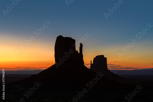 Silhouette of Monument Valley at sunrise, Arizona.