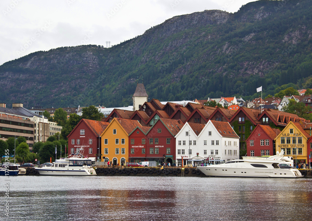 Fototapeta premium Waterfront with historical buildings, and mountains on the background, Bergen, Norway.