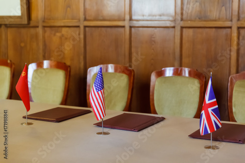 State flags on the table in the hall where the Yalta Conference photo