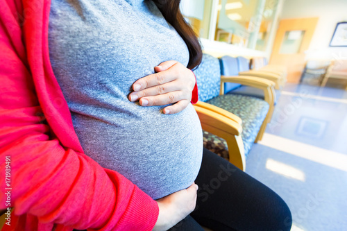 Pregnant woman at the hospital for a prenatal checkup photo