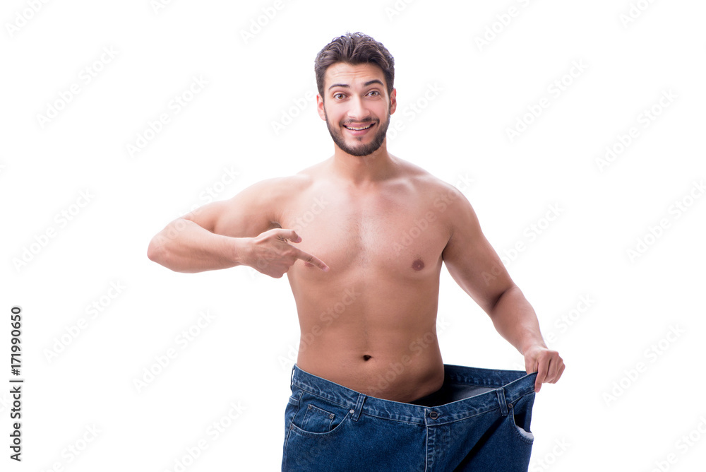 Fototapeta premium Man in dieting concept with oversized jeans