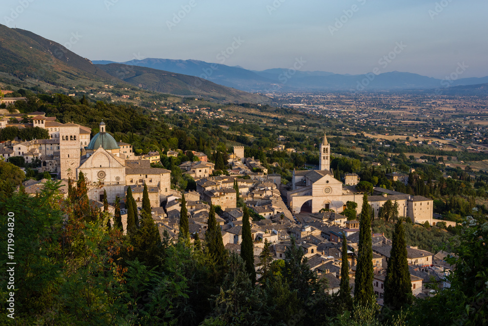 Panoramic view of the ancient town of Assisi at the sunset