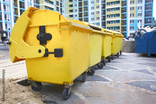 Yellow garbage containers outdoors