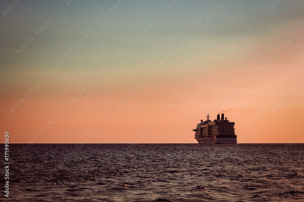 Giant cruise ship at sunset