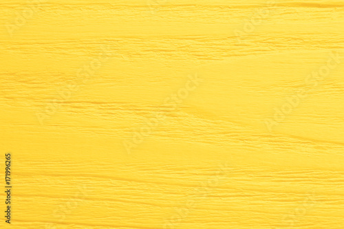 Bright yellow wooden background