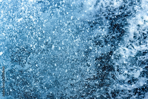 Water splash, background with water drops in blue and white foam
