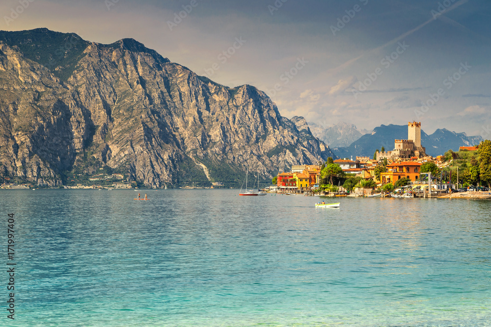 Spectacular Malcesine tourist resort and high mountains, Garda lake, Italy