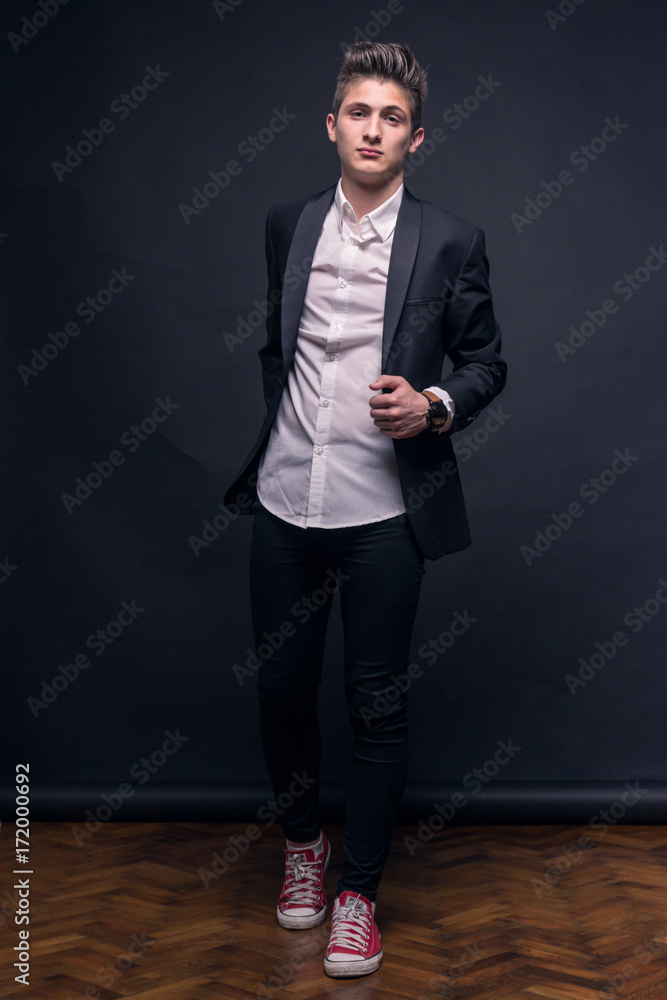 Fototapeta premium one young teenage boy, posing suit
