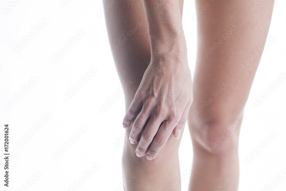 Closeup of female leg with painful knee. Body and health care concept