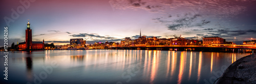 Stockholm sunset skyline with City Hall as seen from Riddarholmen. Panoramic montage from 13 images